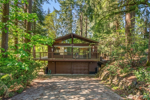 2431 W Lynnwood Dr, Longview, WA 98632 - view of front of home featuring driveway, a garage, and a deck