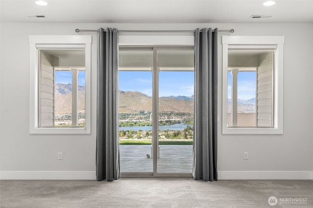 2876 N Brysen Dr, East Wenatchee, WA 98802 - doorway featuring carpet flooring, baseboards, recessed lighting, and a water and mountain view