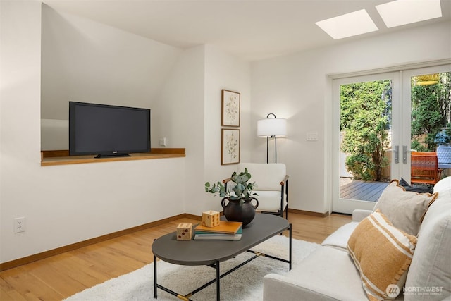 5047 84th Ave SE, Mercer Island, WA 98040 - living area with a skylight, wood finished floors, and baseboards