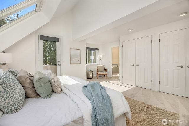 5047 84th Ave SE, Mercer Island, WA 98040 - bedroom featuring carpet flooring, a skylight, recessed lighting, and connected bathroom