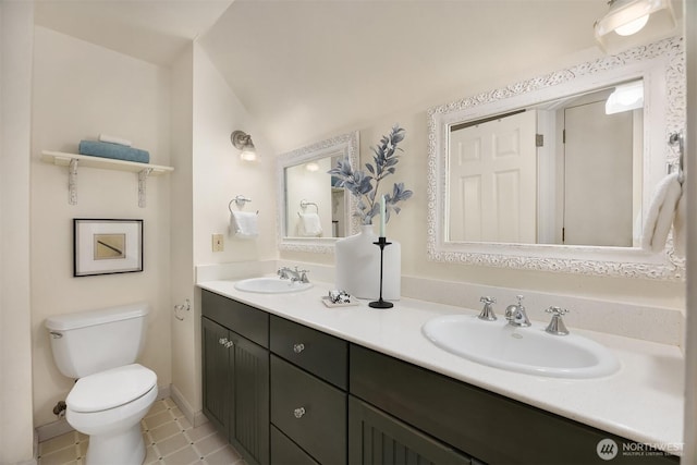 5047 84th Ave SE, Mercer Island, WA 98040 - bathroom with toilet, double vanity, tile patterned flooring, and baseboards