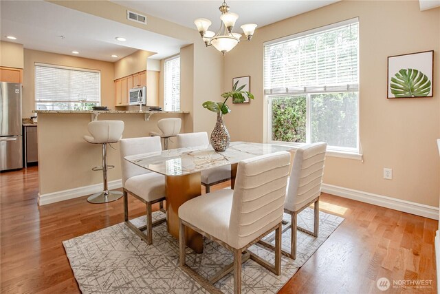 2050 132nd Ave SE Unit E-512, Bellevue, WA 98005 - dining room featuring baseboards, light wood-type flooring, a chandelier, and recessed lighting