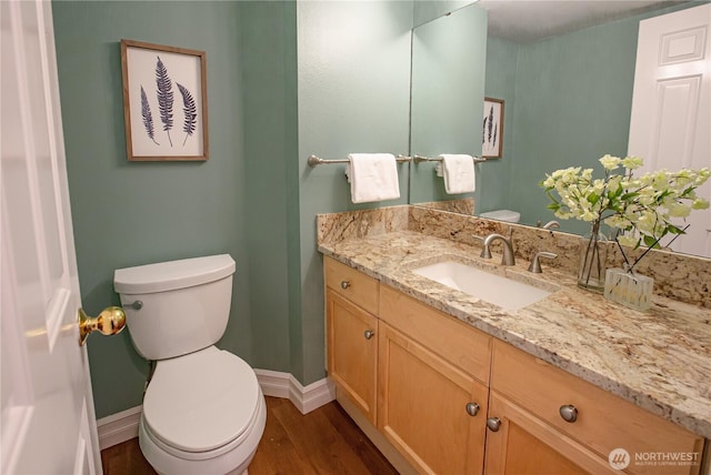 2050 132nd Ave SE Unit E-512, Bellevue, WA 98005 - half bathroom featuring toilet, baseboards, vanity, and wood finished floors