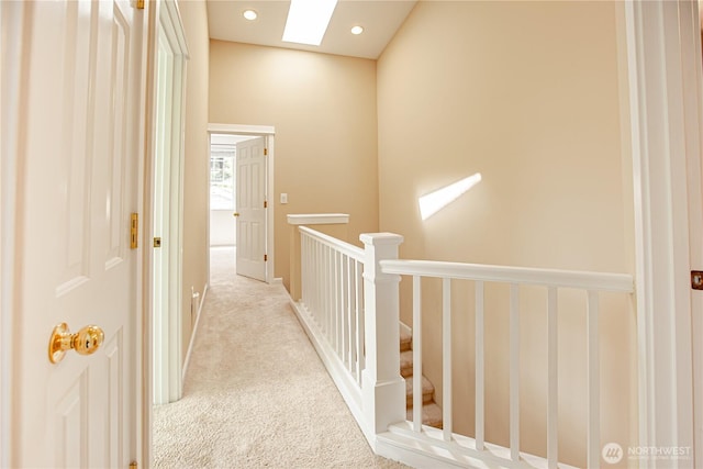 2050 132nd Ave SE Unit E-512, Bellevue, WA 98005 - corridor with a skylight, an upstairs landing, carpet, and recessed lighting