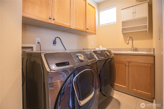 2050 132nd Ave SE Unit E-512, Bellevue, WA 98005 - washroom featuring independent washer and dryer, cabinet space, and light tile patterned flooring