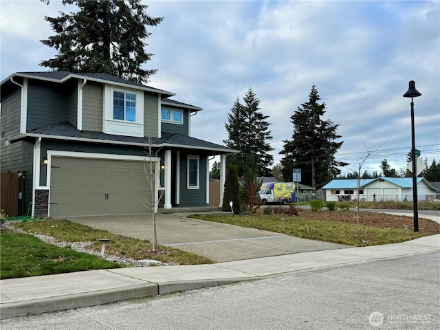 18002 38th Avenue Ct E, Tacoma, WA 98446 - view of front of property featuring concrete driveway and an attached garage
