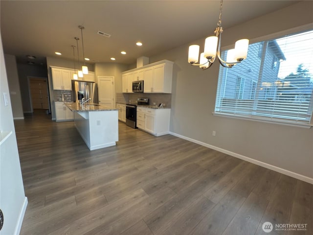 18002 38th Avenue Ct E, Tacoma, WA 98446 - kitchen featuring appliances with stainless steel finishes, baseboards, recessed lighting, a chandelier, and backsplash