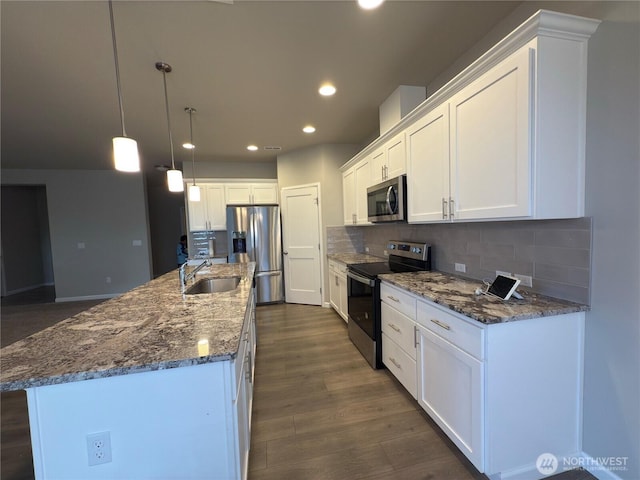 18002 38th Avenue Ct E, Tacoma, WA 98446 - kitchen with appliances with stainless steel finishes, a sink, recessed lighting, white cabinets, and backsplash