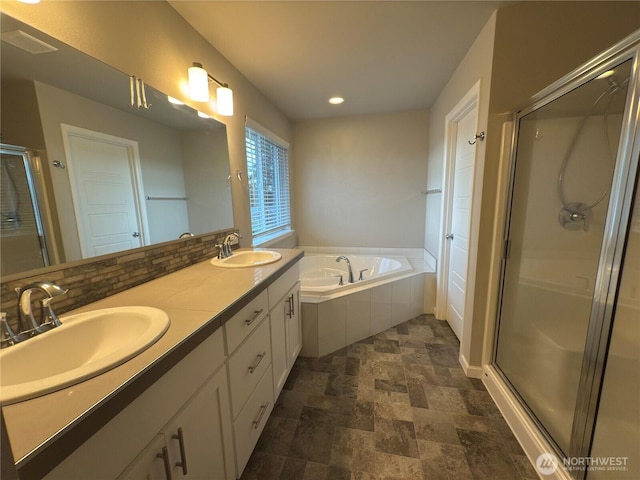 18002 38th Avenue Ct E, Tacoma, WA 98446 - full bath with a shower stall, a garden tub, stone finish flooring, recessed lighting, and double vanity