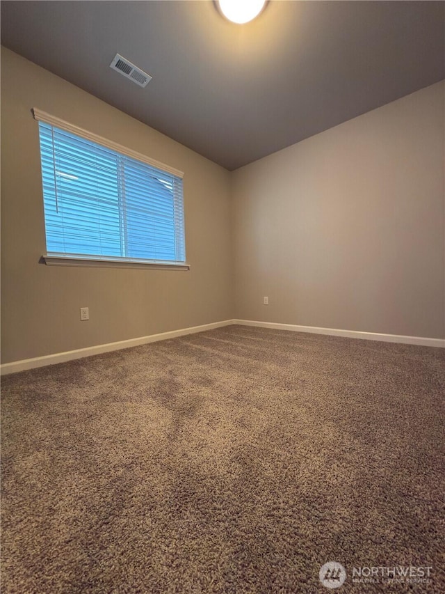 18002 38th Avenue Ct E, Tacoma, WA 98446 - spare room featuring baseboards and carpet