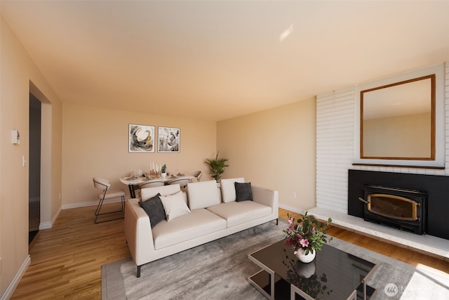 living area with wood finished floors and baseboards
