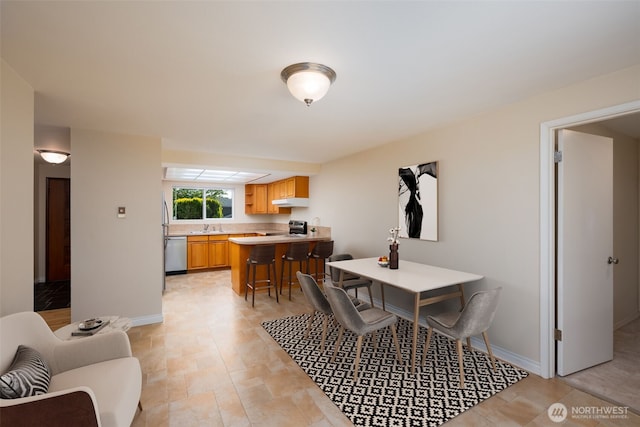 dining room with baseboards