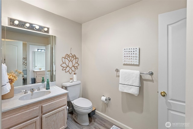 7340 Hawkstone Ave SW, Port Orchard, WA 98367 - bathroom featuring toilet, baseboards, vanity, and wood finished floors