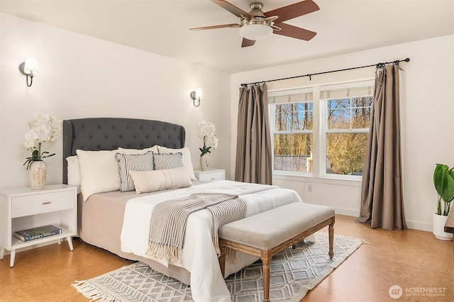 bedroom featuring ceiling fan and baseboards