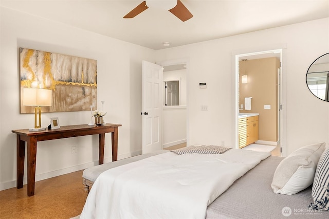 bedroom featuring connected bathroom, a ceiling fan, and baseboards