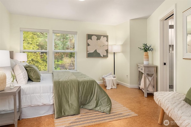 bedroom featuring baseboards