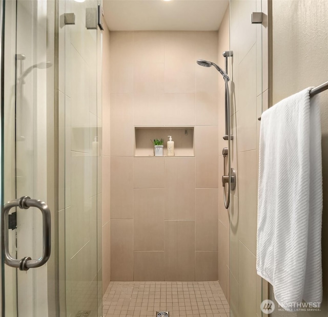bathroom featuring a shower stall