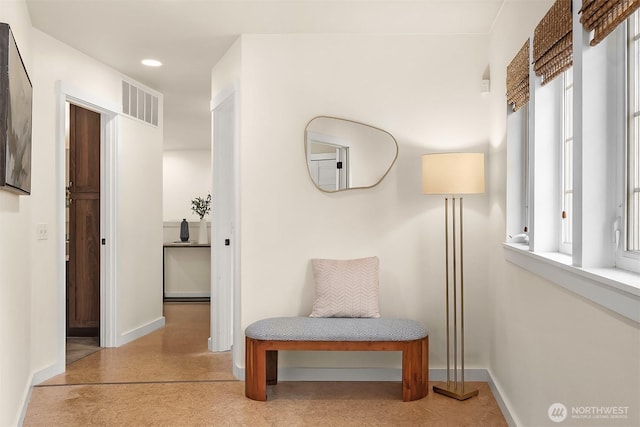 corridor with baseboards and recessed lighting