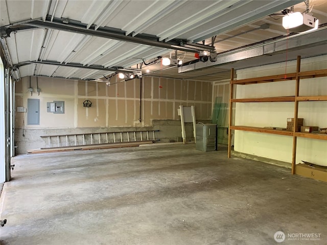garage featuring a garage door opener and electric panel