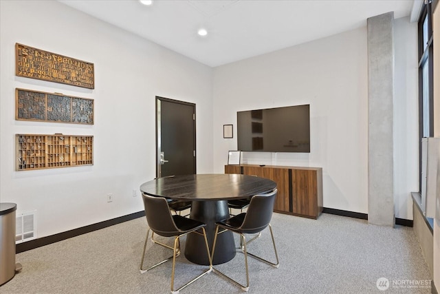 dining room featuring baseboards and recessed lighting