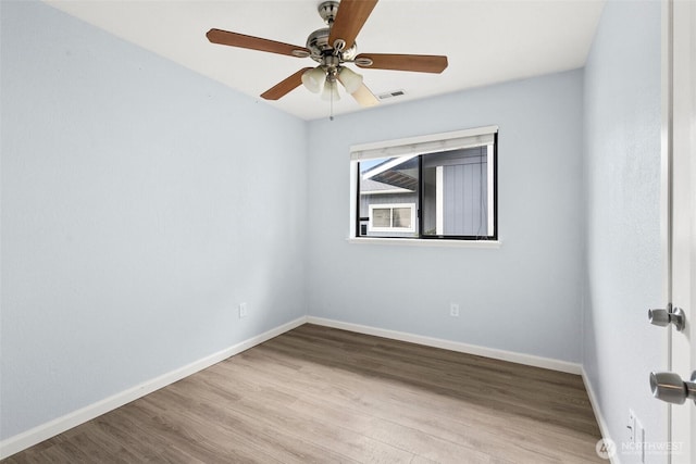 7225 E F St, Tacoma, WA 98404 - empty room with wood finished floors and a ceiling fan
