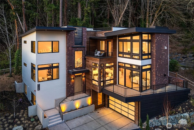 7128 NE 119th Ln, Kirkland, WA 98034 - contemporary house with a balcony and a wooded view