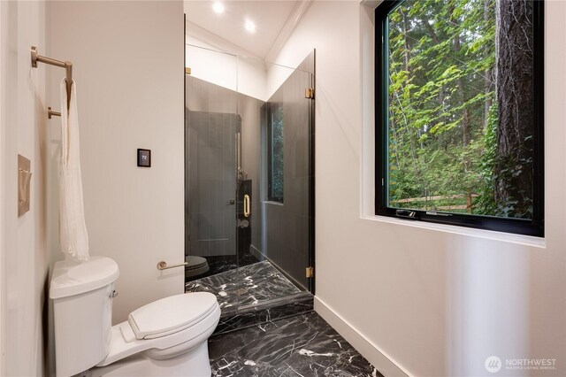 7128 NE 119th Ln, Kirkland, WA 98034 - bathroom featuring toilet, marble tiled floors, a shower stall, and baseboards
