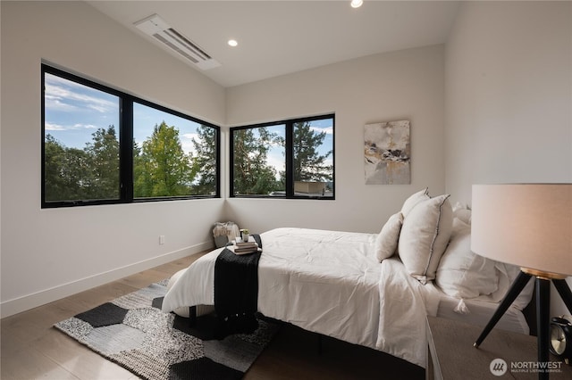 7128 NE 119th Ln, Kirkland, WA 98034 - bedroom featuring recessed lighting, wood finished floors, and baseboards