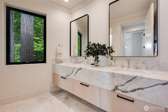 7128 NE 119th Ln, Kirkland, WA 98034 - bathroom with marble tiled floors, double vanity, crown molding, and baseboards