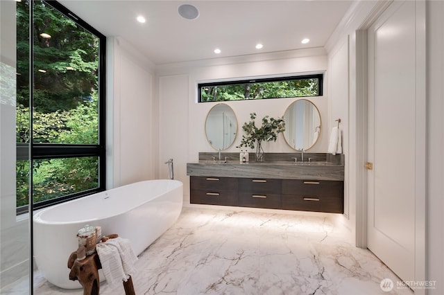 7128 NE 119th Ln, Kirkland, WA 98034 - bathroom featuring double vanity, a soaking tub, recessed lighting, and marble tiled flooring