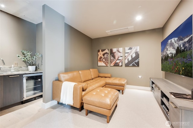 7128 NE 119th Ln, Kirkland, WA 98034 - living room with beverage cooler, bar with sink, baseboards, and recessed lighting
