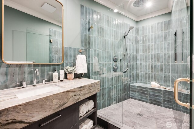 7128 NE 119th Ln, Kirkland, WA 98034 - full bathroom featuring tile walls, a tile shower, ornamental molding, and vanity