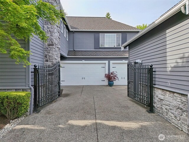 451 245th Ave SE, Sammamish, WA 98074 - garage with driveway and a gate