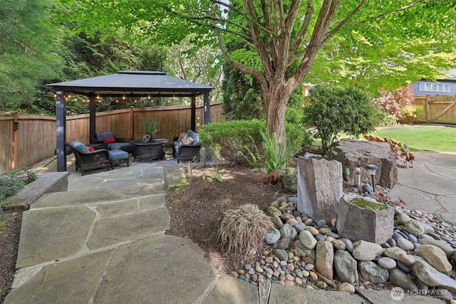 451 245th Ave SE, Sammamish, WA 98074 - fenced backyard with a patio area, a gazebo, and an outdoor living space