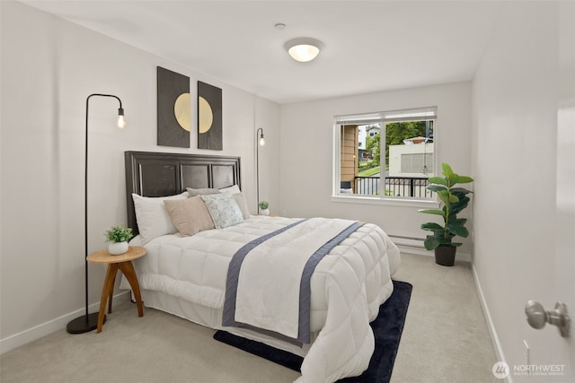 carpeted bedroom featuring baseboards