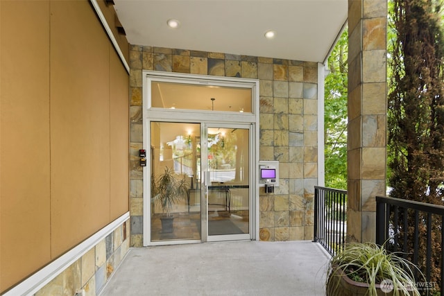 entrance to property with stone siding