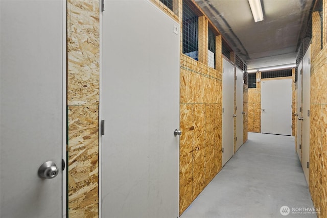 corridor featuring concrete flooring