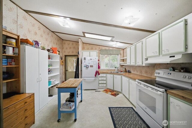 17465 NE Noll Rd NE, Poulsbo, WA 98370 - kitchen featuring white appliances, under cabinet range hood, wallpapered walls, open shelves, and a sink