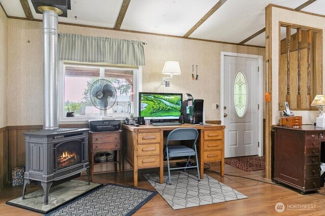 17465 NE Noll Rd NE, Poulsbo, WA 98370 - office featuring a wood stove, wood finished floors, wallpapered walls, and wainscoting
