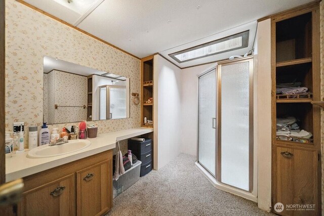 17465 NE Noll Rd NE, Poulsbo, WA 98370 - bathroom with a shower stall, vanity, and wallpapered walls