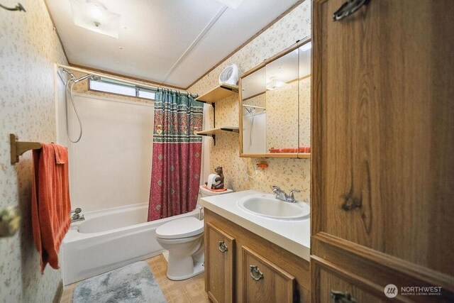 17465 NE Noll Rd NE, Poulsbo, WA 98370 - bathroom with wallpapered walls, shower / bathtub combination with curtain, toilet, and vanity