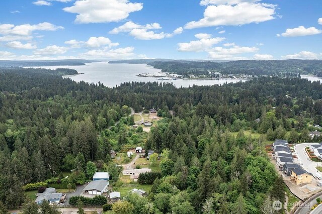 17465 NE Noll Rd NE, Poulsbo, WA 98370 - drone / aerial view of a heavily wooded area and a large body of water