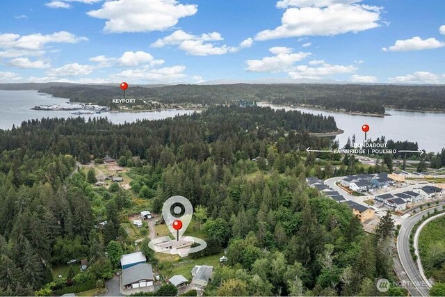 17465 NE Noll Rd NE, Poulsbo, WA 98370 - bird's eye view of a heavily wooded area and a large body of water