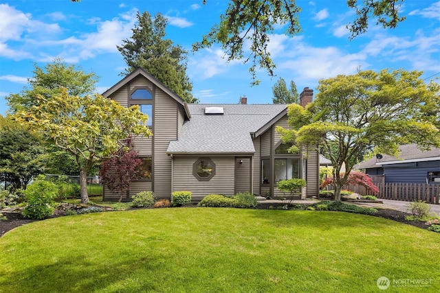 view of front of home featuring roof with shingles and a chimney