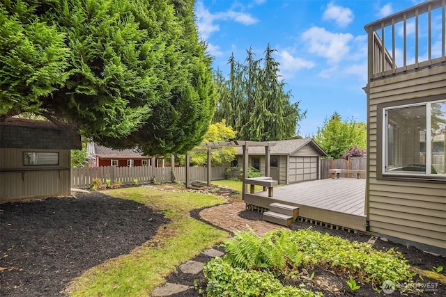 fenced backyard with a wooden deck, an outdoor structure, a pergola, and a shed