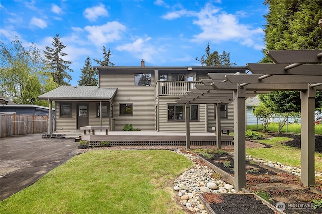 back of house featuring a chimney, a pergola, and a wooden deck
