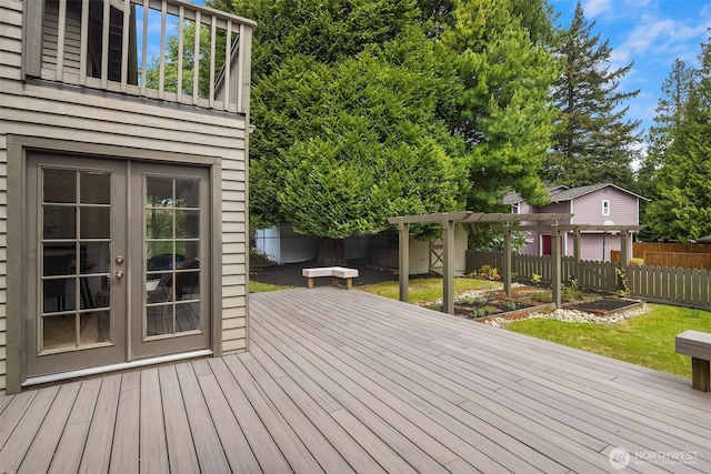 wooden deck featuring french doors and a pergola