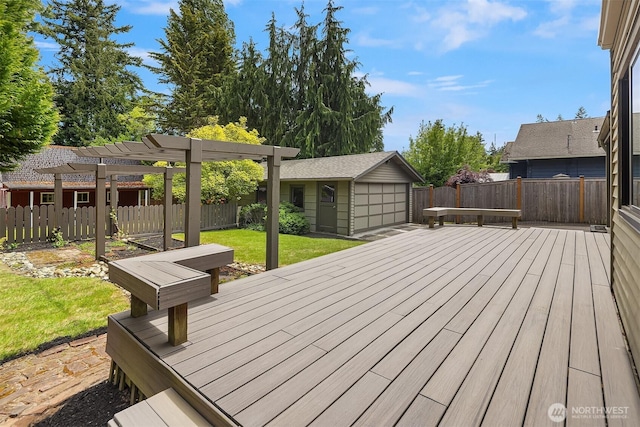 wooden terrace featuring an outdoor structure, a pergola, and a detached garage