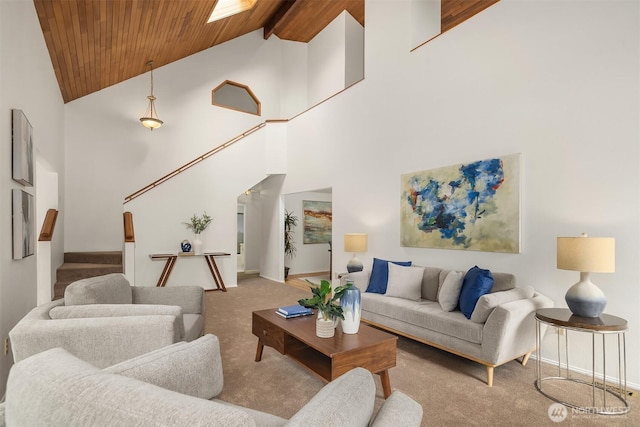 carpeted living room featuring high vaulted ceiling, wood ceiling, baseboards, stairs, and beam ceiling