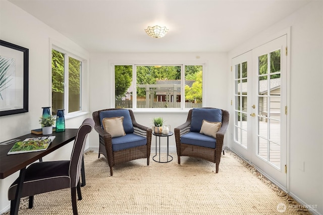 sunroom / solarium featuring french doors, carpet floors, and baseboards